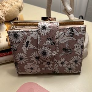 Multi pocket wallet with clasp closure in back. Lots of space for cards!